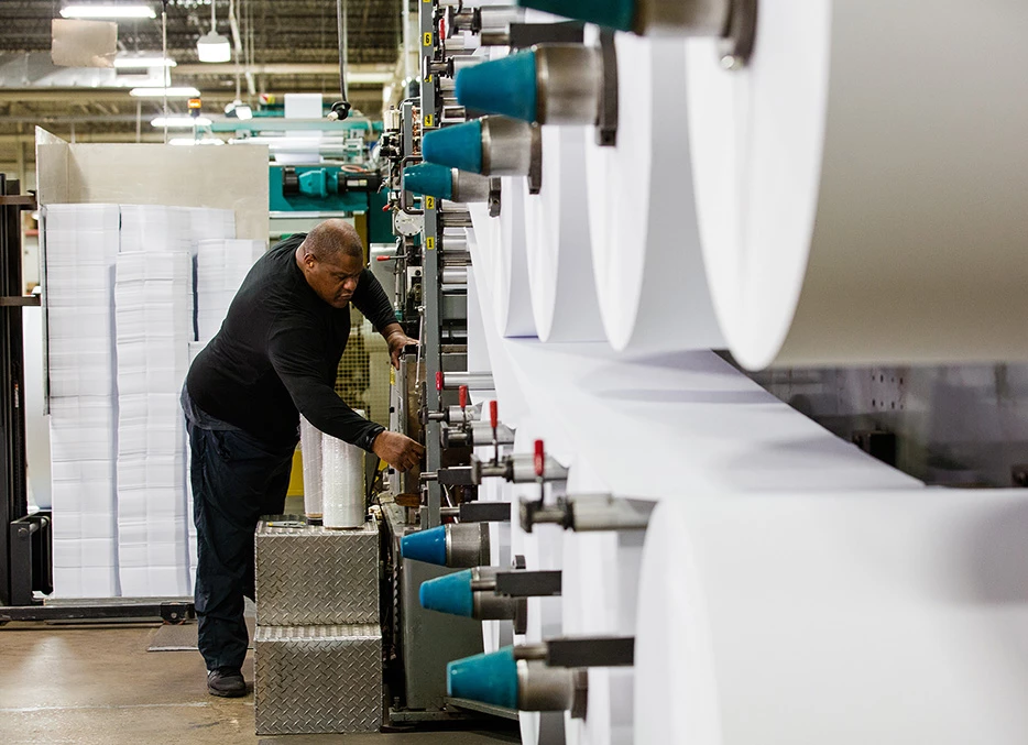 Worker Adjusting Paper Machine